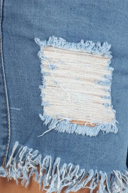 Ripped denim shorts with cut-off frayed hem